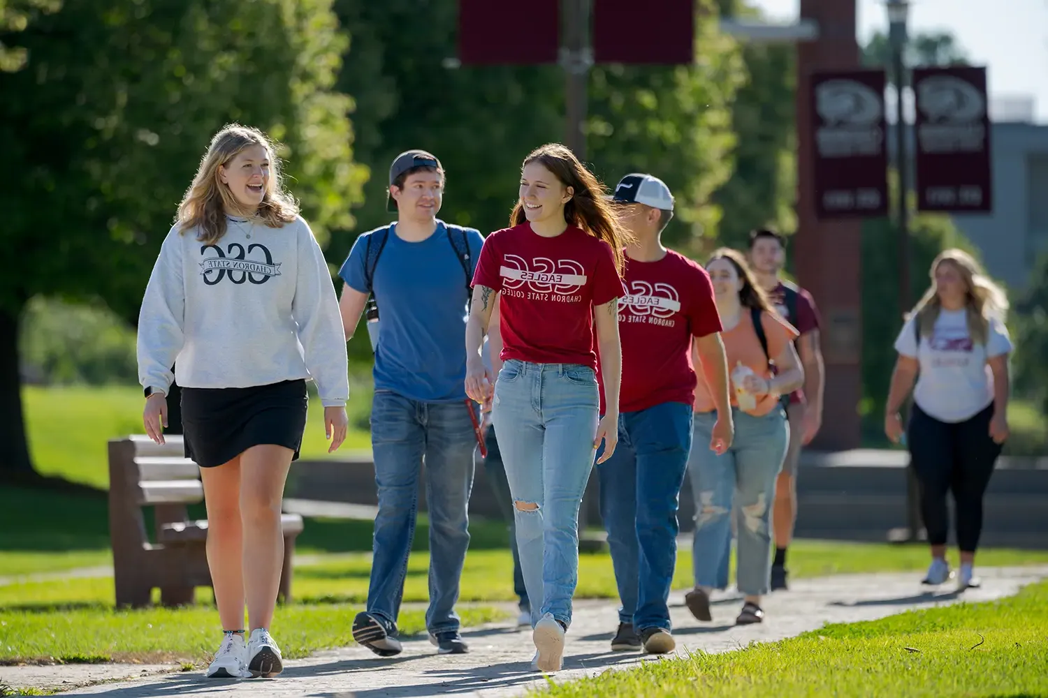 A group of students walks down the main thoroughfare